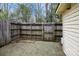 Enclosed backyard featuring a wooden fence and a concrete patio area, providing a private and secure outdoor space at 1113 Keswick Pl # 118, Monroe, NC 28112