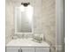 Contemporary bathroom features a bright vanity, stylish faucet, and neutral gray tiling offering a fresh, clean aesthetic at 1113 Keswick Pl # 118, Monroe, NC 28112