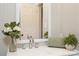 Modern bathroom featuring a clean vanity, sleek faucet, and decorative accents enhancing the neutral-toned space at 1113 Keswick Pl # 118, Monroe, NC 28112