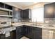 Well-lit kitchen with modern appliances, granite countertops, and stylish backsplash at 1113 Keswick Pl # 118, Monroe, NC 28112