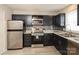 Modern kitchen featuring stainless steel appliances, sleek countertops, and stylish backsplash at 1113 Keswick Pl # 118, Monroe, NC 28112