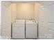 Functional laundry room with a washer and dryer, offering practical convenience within a compact space at 1113 Keswick Pl # 118, Monroe, NC 28112