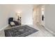 Cozy living room with modern flooring, plush rug, and neutral color palette at 1113 Keswick Pl # 118, Monroe, NC 28112