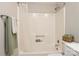 Bright shower tub featuring neutral walls, towel bar, and shower head, offers a clean and functional space at 1113 Keswick Pl # 118, Monroe, NC 28112