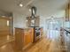 Spacious kitchen island with a stainless steel cooktop and hardwood floors at 12011 Stoney Meadow Dr, Mint Hill, NC 28227