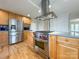 Well-equipped kitchen featuring stainless steel appliances and a center island cooktop at 12011 Stoney Meadow Dr, Mint Hill, NC 28227
