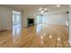 Bright and spacious living room with beautiful hardwood floors and a cozy fireplace at 12011 Stoney Meadow Dr, Mint Hill, NC 28227