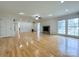 Bright, spacious living room featuring hardwood floors, fireplace, and lots of natural light at 12011 Stoney Meadow Dr, Mint Hill, NC 28227