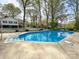 A captivating in-ground pool offers a refreshing oasis and adds to the charm of the backyard at 12011 Stoney Meadow Dr, Mint Hill, NC 28227