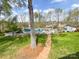 Inviting backyard pool area surrounded by a classic white picket fence and mature trees at 12011 Stoney Meadow Dr, Mint Hill, NC 28227