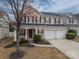 Attractive home featuring a covered front porch, two-car garage, and well-manicured landscaping at 125 Colville Rd, Mooresville, NC 28117