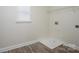Bright laundry area featuring wood-look floors, a window, and laundry connections at 125 Colville Rd, Mooresville, NC 28117