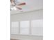 Bright living room with neutral walls, ceiling fan, and large windows with horizontal blinds at 125 Colville Rd, Mooresville, NC 28117