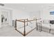 Bright landing area with staircase, baby gate and comfortable seating area at 12706 Heath Grove Dr, Huntersville, NC 28078