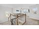 Loft area overlooking the living room showcases an open concept design with large windows and plenty of natural light at 12706 Heath Grove Dr, Huntersville, NC 28078