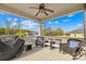 Relaxing covered porch with ceiling fan and comfortable wicker seating overlooking backyard at 12706 Heath Grove Dr, Huntersville, NC 28078