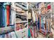 Organized walk-in closet with tiered shelving and hanging storage at 12706 Heath Grove Dr, Huntersville, NC 28078