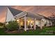 Charming back patio features a pergola-covered seating area, ideal for relaxing or entertaining with stylish decor at 12912 Bailey Rd, Cornelius, NC 28031