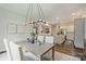 Bright open-concept with dining room and kitchen with stainless steel appliances and breakfast bar at 12912 Bailey Rd, Cornelius, NC 28031