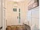 Bright foyer showcasing a stylish chandelier, decorative woodwork, and elegant decor at 12912 Bailey Rd, Cornelius, NC 28031