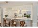 Bright kitchen featuring a breakfast bar, stainless steel appliances, and a neutral color palette at 12912 Bailey Rd, Cornelius, NC 28031