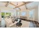 Spacious living room with a large window, hardwood floors, and comfortable seating at 12912 Bailey Rd, Cornelius, NC 28031