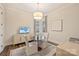 Bright office with wood floors, modern lighting, and a comfortable seating area at 12912 Bailey Rd, Cornelius, NC 28031