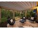 Outdoor patio area with comfortable seating, stylish decor, and pergola at 12912 Bailey Rd, Cornelius, NC 28031