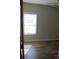 Bedroom featuring a vaulted ceiling and a large window, offering natural light at 13016 Meadowmere Rd, Huntersville, NC 28078