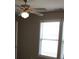 Bright bedroom features a ceiling fan and neutral walls at 13016 Meadowmere Rd, Huntersville, NC 28078