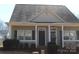 Inviting home exterior with a covered porch, offering curb appeal and a cozy entrance at 13016 Meadowmere Rd, Huntersville, NC 28078
