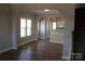 Living room with wood floors, open floor plan at 13016 Meadowmere Rd, Huntersville, NC 28078