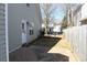 Side yard has a brick pathway and small yard at 13016 Meadowmere Rd, Huntersville, NC 28078