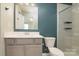 Modern bathroom with white vanity, quartz countertop, and a glass-enclosed shower at 13304 Porter Creek Rd, Charlotte, NC 28262