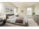 Staged bedroom with neutral walls, ample natural light, and comfortable furnishings at 13304 Porter Creek Rd, Charlotte, NC 28262