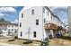 Exterior view of townhouses showing individual balconies and meticulous landscaping, creating a welcoming residential environment at 13304 Porter Creek Rd, Charlotte, NC 28262