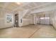 Spacious unfinished garage with a window providing natural light and ample space for vehicles and storage at 13304 Porter Creek Rd, Charlotte, NC 28262