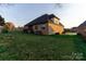 Large backyard with lush green lawn and home exterior at 1358 37Th Avenue Ne Pl, Hickory, NC 28601