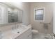 Bright bathroom with a framed mirror, vanity, and neutral paint at 1358 37Th Avenue Ne Pl, Hickory, NC 28601