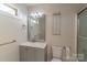 Bathroom featuring granite countertop, modern lighting, and glass shower at 1358 37Th Avenue Ne Pl, Hickory, NC 28601
