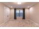 Bedroom features neutral carpeting and paint with a window to let in natural light at 1358 37Th Avenue Ne Pl, Hickory, NC 28601