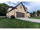 Side view of a brick home with a two car garage, and a well manicured lawn at 1358 37Th Avenue Ne Pl, Hickory, NC 28601