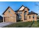 Charming brick home featuring a well-manicured lawn, a two-car garage, and a classic architectural design at 1358 37Th Avenue Ne Pl, Hickory, NC 28601