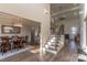 Bright foyer with hardwood floors, staircase and dining room featuring elegant chandelier at 1358 37Th Avenue Ne Pl, Hickory, NC 28601