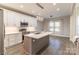 A bright kitchen showcases a large island, stainless appliances, and ample storage with a lovely eating area at 1358 37Th Avenue Ne Pl, Hickory, NC 28601