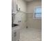 Convenient laundry room with utility sink, cabinet, and tile floors at 1358 37Th Avenue Ne Pl, Hickory, NC 28601
