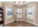 Bright living room with wood floors, neutral paint, and three sunny windows at 1358 37Th Avenue Ne Pl, Hickory, NC 28601