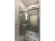 Modern tiled shower with glass door, multiple shower heads, and sleek hardware at 1358 37Th Avenue Ne Pl, Hickory, NC 28601