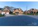 Street view of a brick home with a two car garage on a sunny day in a suburban neighborhood at 1358 37Th Avenue Ne Pl, Hickory, NC 28601