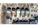 An aerial view of closely built homes featuring manicured lawns, driveways, and tree-lined streets at 14024 Alley Son St, Huntersville, NC 28078